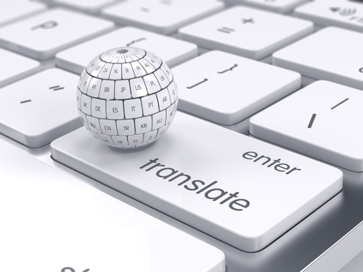 A while globe on a translate button of a white keyboard illustrating the importance of translation services singapore
