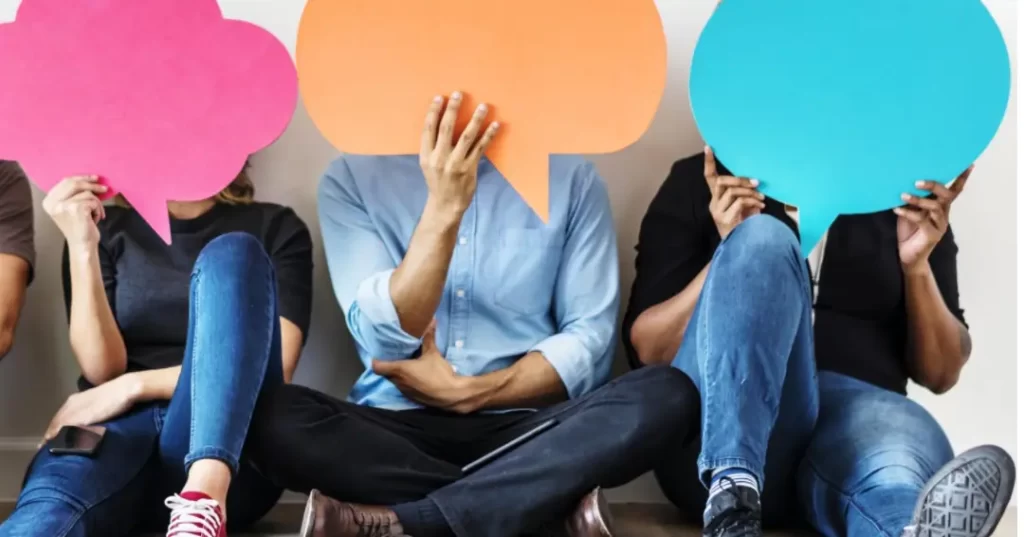 3 person holding text box placard in front of their faces illustrating importance of accurate translation services in Singapore