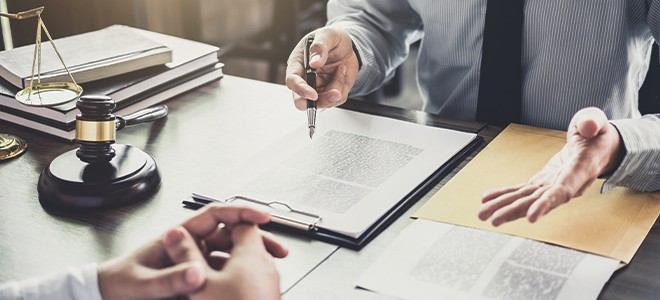 A lawyer explaining the agreement contract to his client illustrating the 5 main types of legal translation services in singapore