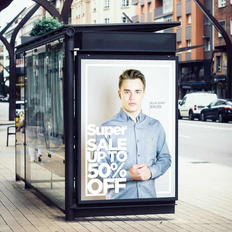 Display ads beside a bus stop illustrating the importance of marketing translation services