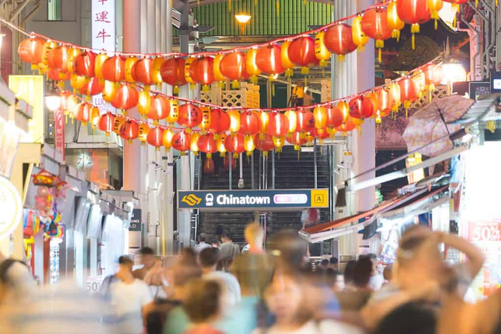 Crowded people in Chinatown area of Singapore illustrating the importance of Chinese translation services