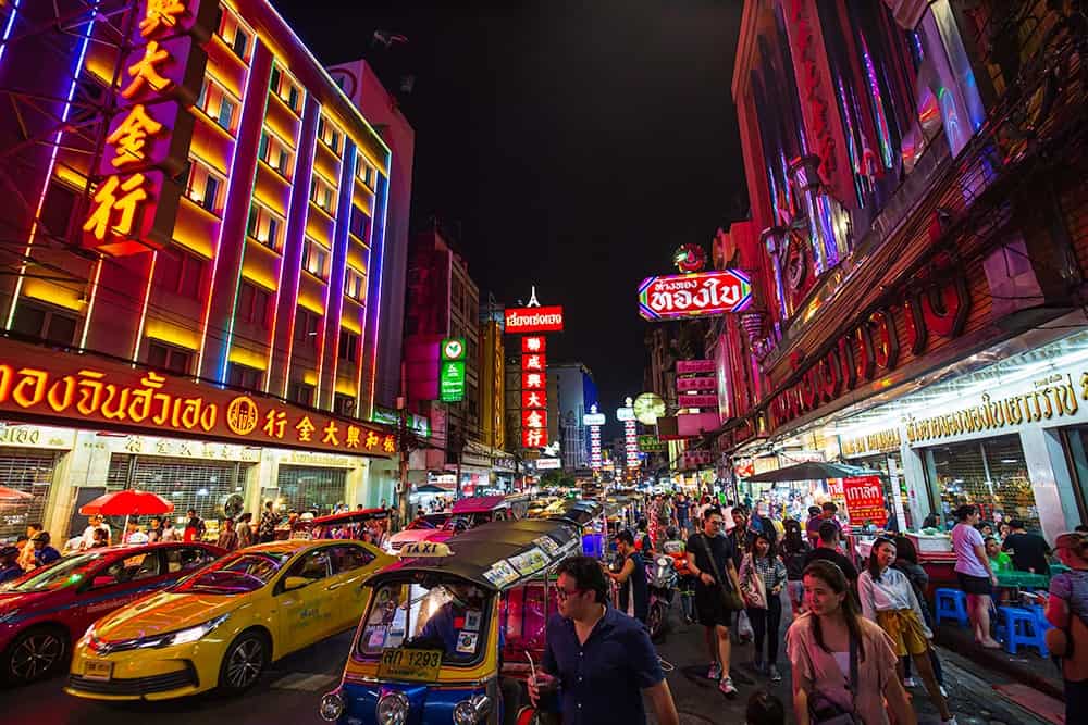 Busy thai streets at night to illustrate the importance of thai translation services in singapore