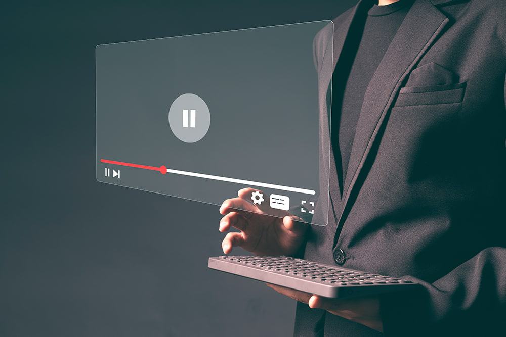 A transcriber at work listening to the video recording illustrating the importance of transcription services