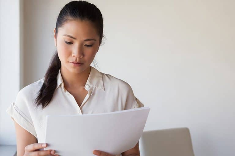 A lady vetting a copy illustrating the importance of vetting services